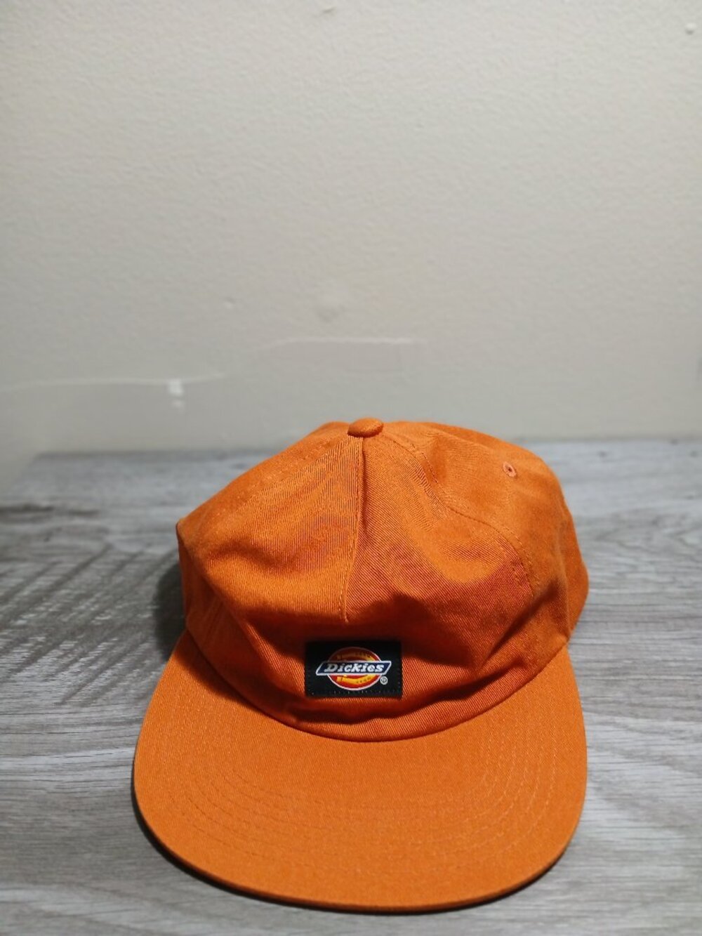 Dickies orange cap  , one size fits all ,  with Dickies logo in front.  100 % co